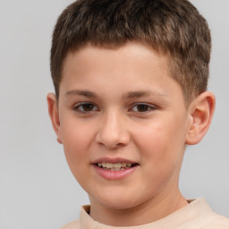 Joyful white child male with short  brown hair and brown eyes