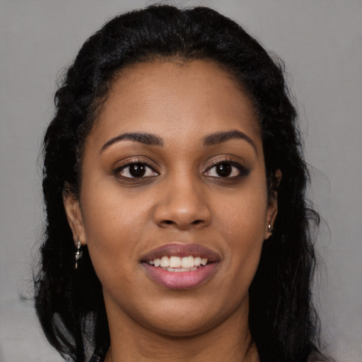 Joyful latino young-adult female with long  black hair and brown eyes