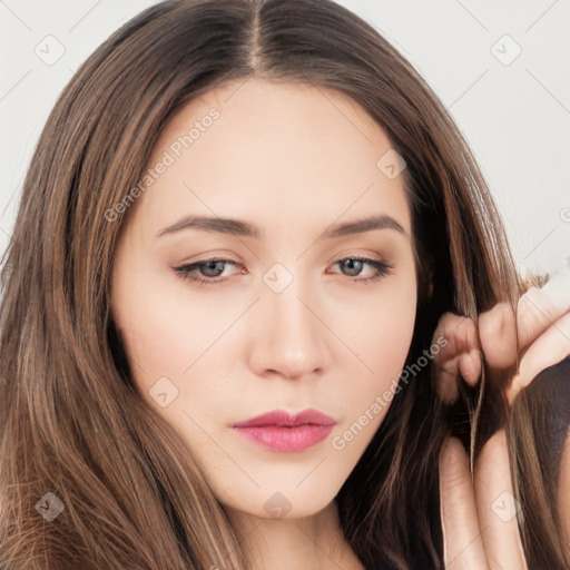 Neutral white young-adult female with long  brown hair and brown eyes