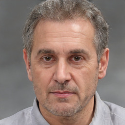 Neutral white middle-aged male with short  brown hair and brown eyes