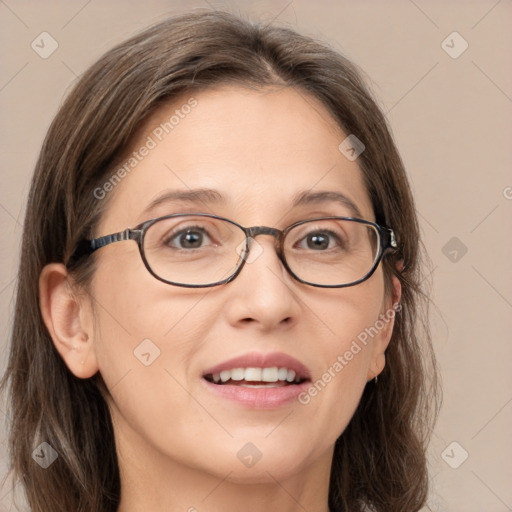 Joyful white adult female with medium  brown hair and grey eyes