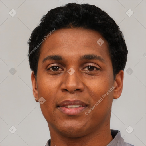 Joyful black young-adult male with short  black hair and brown eyes