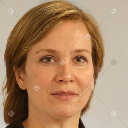 Joyful white adult female with medium  brown hair and blue eyes