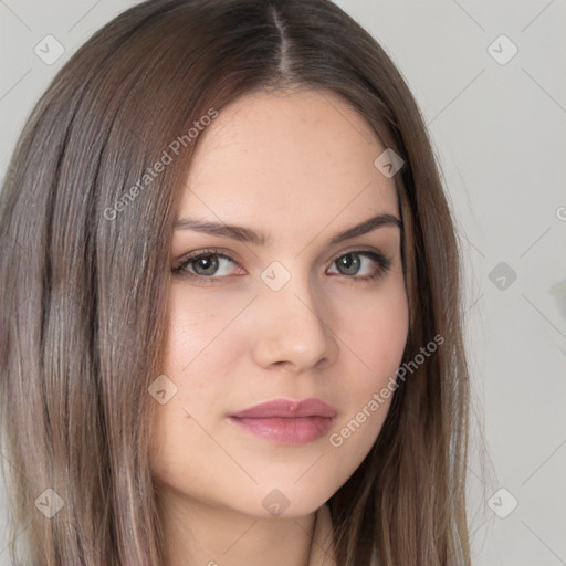 Neutral white young-adult female with long  brown hair and brown eyes