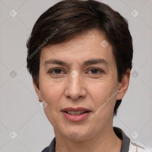 Joyful white adult female with short  brown hair and brown eyes