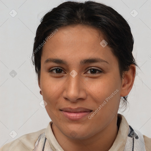 Joyful latino young-adult female with short  brown hair and brown eyes
