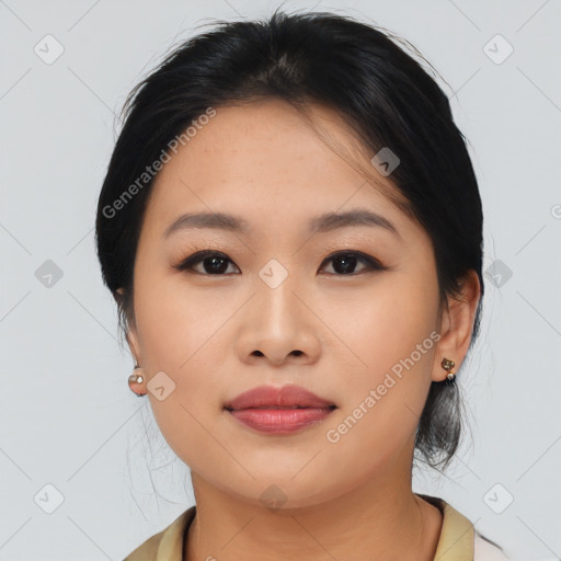 Joyful asian young-adult female with medium  black hair and brown eyes