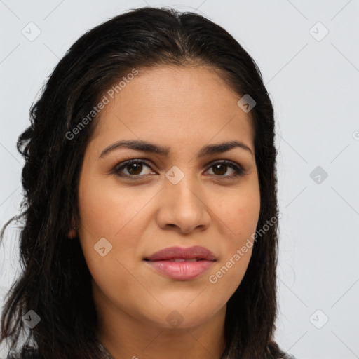 Joyful latino young-adult female with long  brown hair and brown eyes