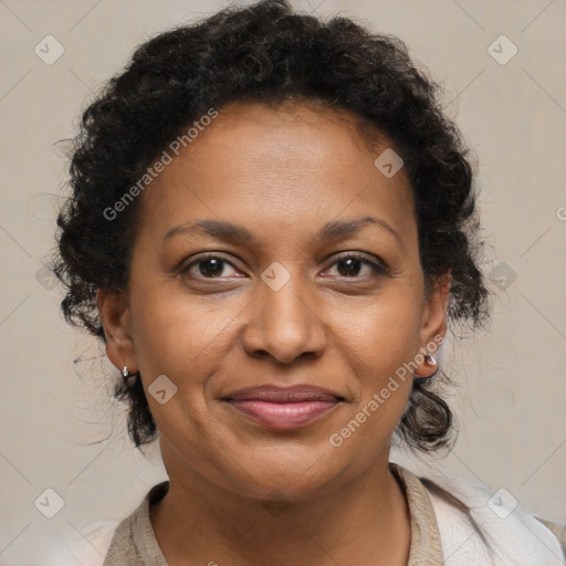 Joyful black adult female with medium  brown hair and brown eyes