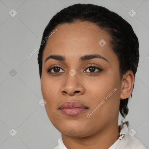 Joyful latino young-adult female with short  black hair and brown eyes