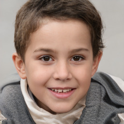 Joyful white child female with short  brown hair and brown eyes