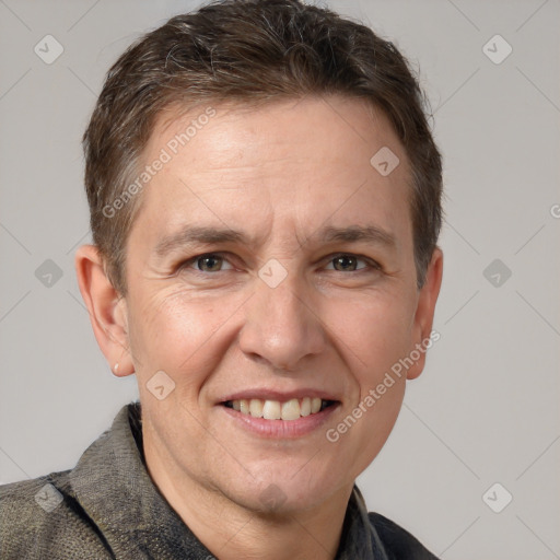 Joyful white adult male with short  brown hair and grey eyes