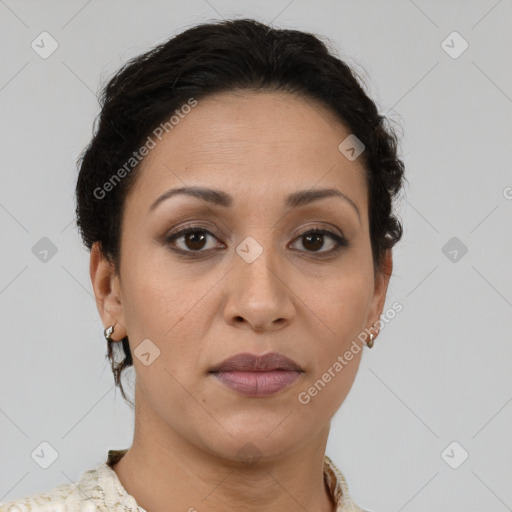 Joyful latino young-adult female with short  brown hair and brown eyes