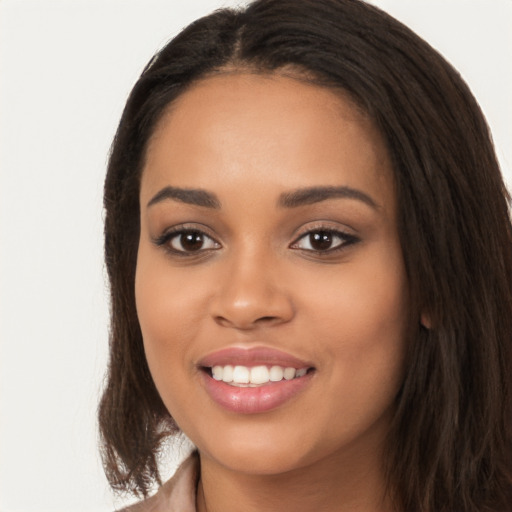 Joyful latino young-adult female with long  brown hair and brown eyes