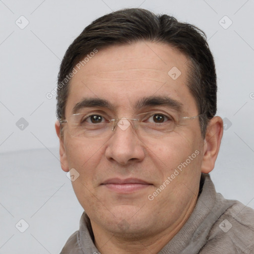 Joyful white adult male with short  brown hair and brown eyes