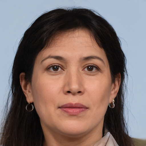 Joyful white adult female with long  brown hair and brown eyes