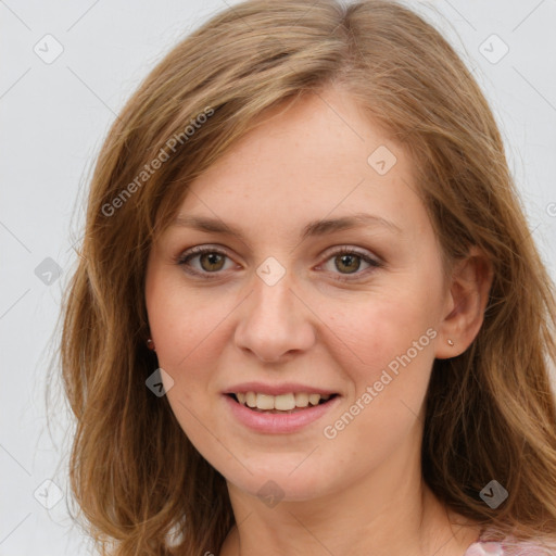 Joyful white young-adult female with long  brown hair and green eyes