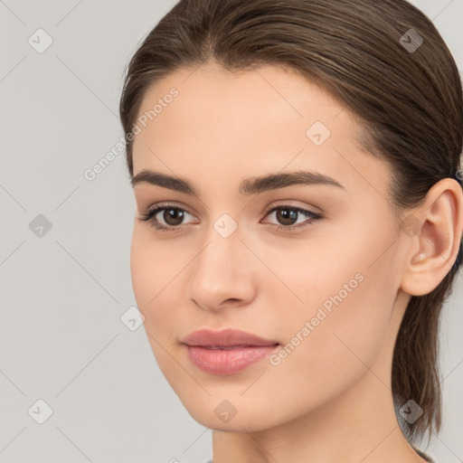 Neutral white young-adult female with long  brown hair and brown eyes