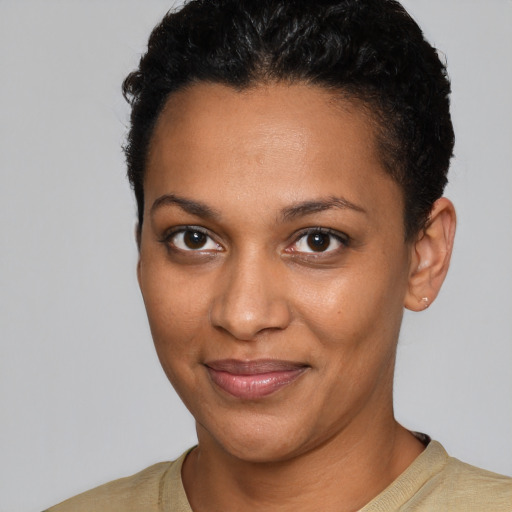 Joyful black young-adult female with short  brown hair and brown eyes