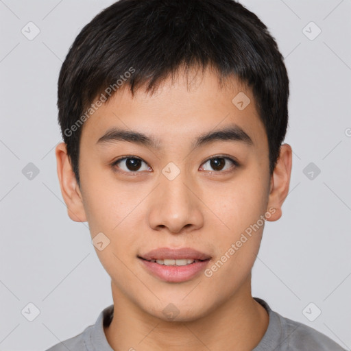 Joyful asian young-adult male with short  brown hair and brown eyes
