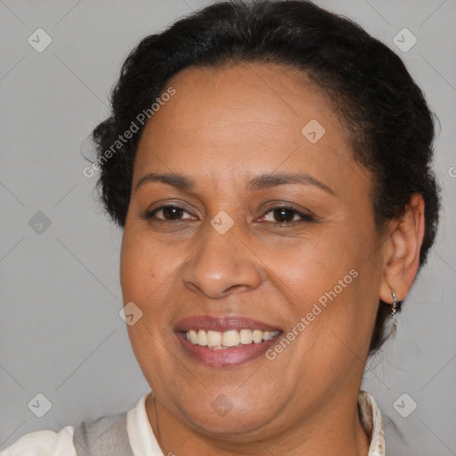 Joyful black adult female with short  brown hair and brown eyes