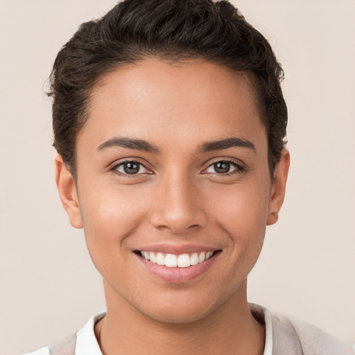 Joyful white young-adult female with short  brown hair and brown eyes