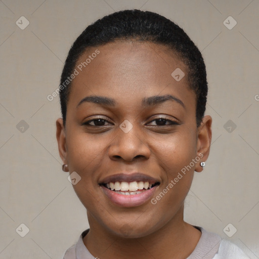 Joyful black young-adult female with short  black hair and brown eyes