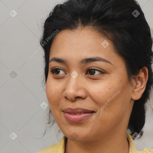 Joyful latino young-adult female with medium  brown hair and brown eyes