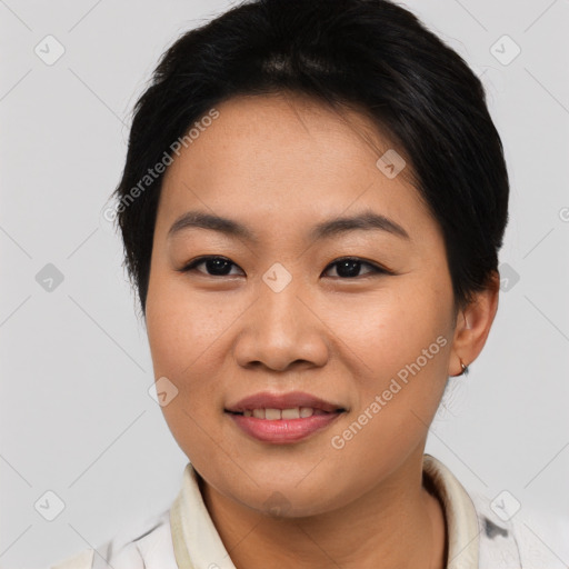 Joyful asian young-adult female with short  brown hair and brown eyes