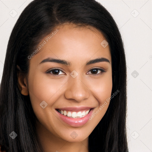 Joyful latino young-adult female with long  brown hair and brown eyes