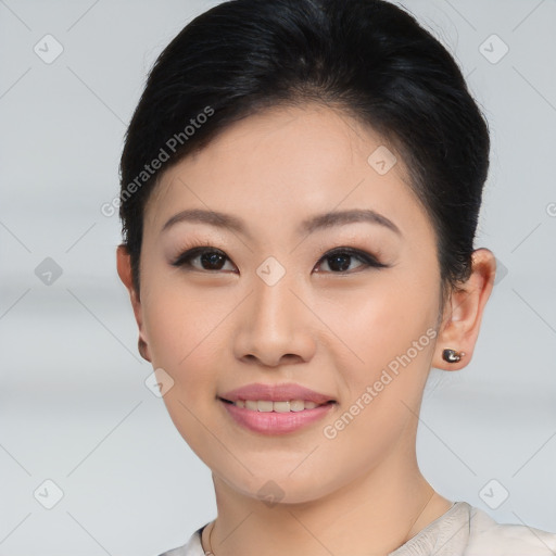 Joyful asian young-adult female with short  black hair and brown eyes