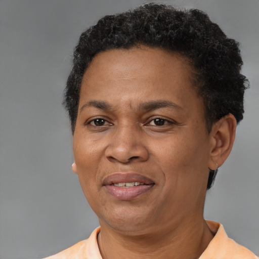 Joyful latino adult female with short  brown hair and brown eyes