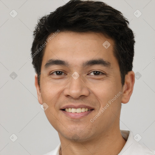 Joyful white young-adult male with short  black hair and brown eyes