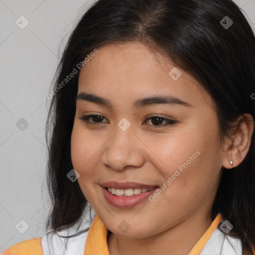 Joyful asian young-adult female with medium  brown hair and brown eyes