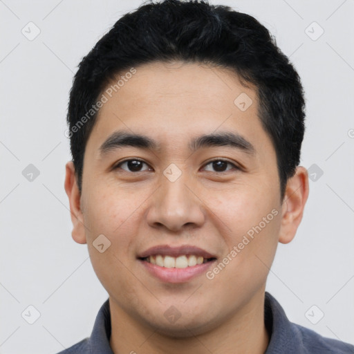 Joyful white young-adult male with short  black hair and brown eyes