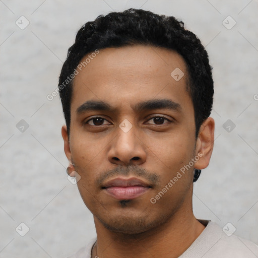 Neutral latino young-adult male with short  black hair and brown eyes