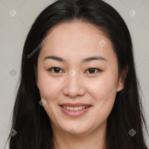 Joyful asian young-adult female with long  brown hair and brown eyes