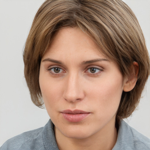 Neutral white young-adult female with medium  brown hair and grey eyes