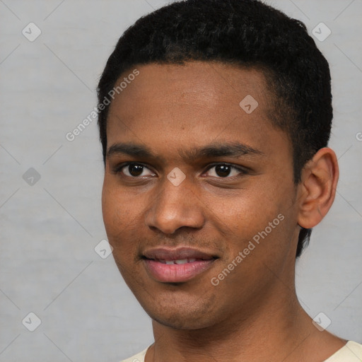 Joyful black young-adult male with short  black hair and brown eyes