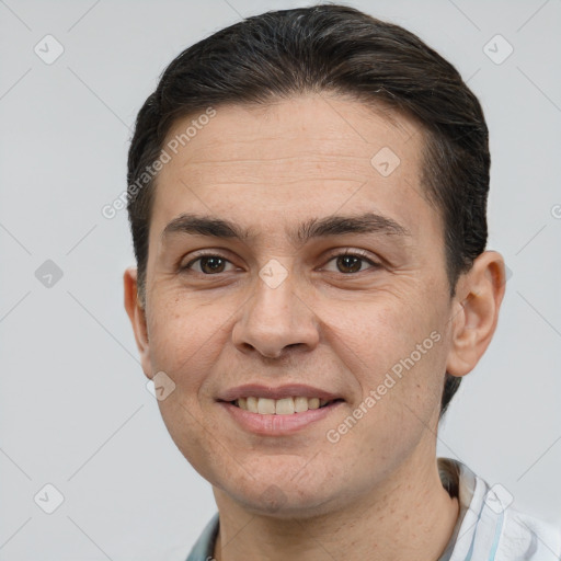 Joyful white adult male with short  brown hair and brown eyes