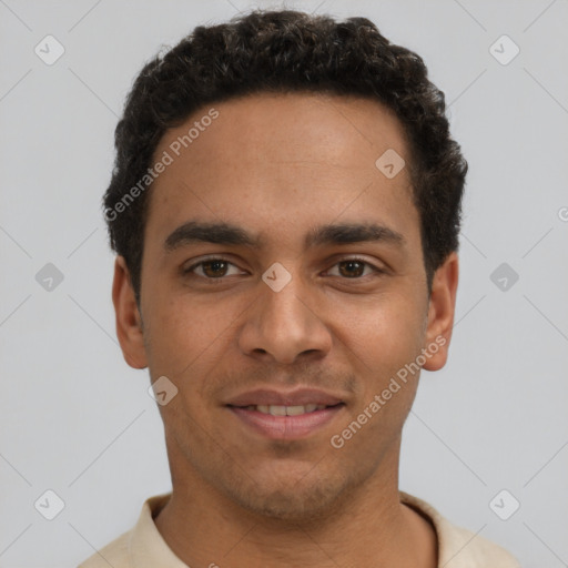 Joyful latino young-adult male with short  brown hair and brown eyes