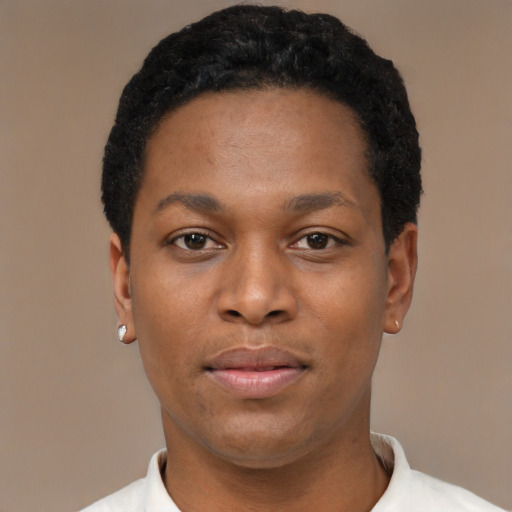 Joyful black young-adult male with short  black hair and brown eyes