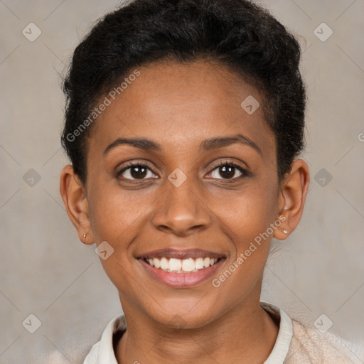 Joyful black young-adult female with short  brown hair and brown eyes