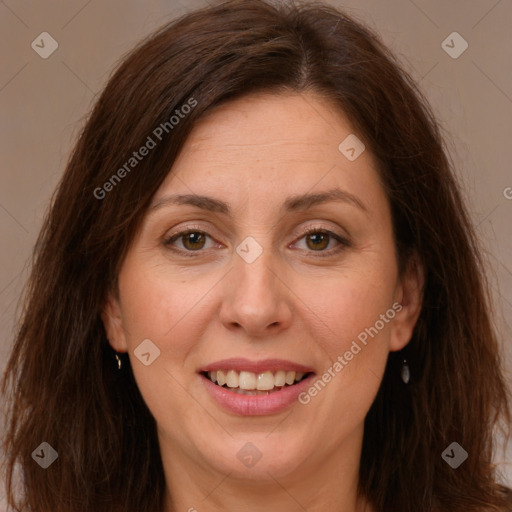 Joyful white adult female with long  brown hair and brown eyes