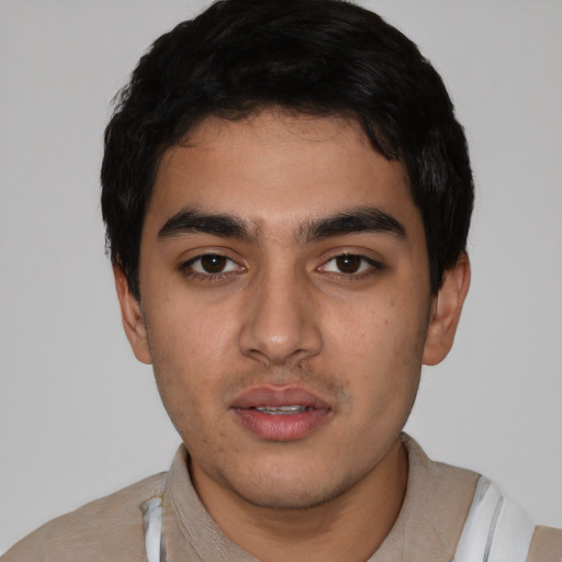 Neutral latino young-adult male with short  black hair and brown eyes