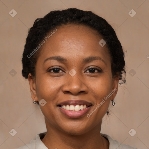 Joyful black young-adult female with short  brown hair and brown eyes