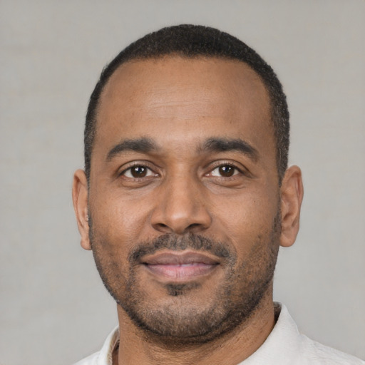 Neutral latino adult male with short  black hair and brown eyes