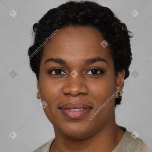 Joyful black young-adult female with short  black hair and brown eyes