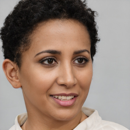 Joyful latino young-adult female with short  brown hair and brown eyes
