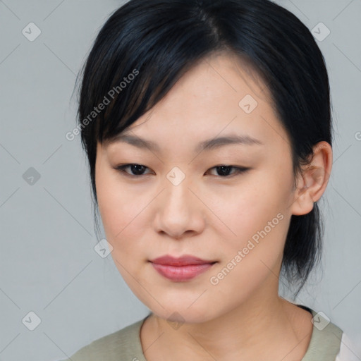 Joyful asian young-adult female with medium  black hair and brown eyes